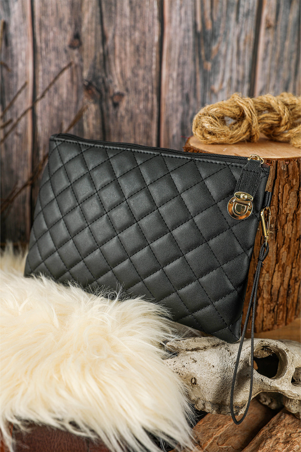 Black Quilted Leather Wrist Strap Clutch Bag