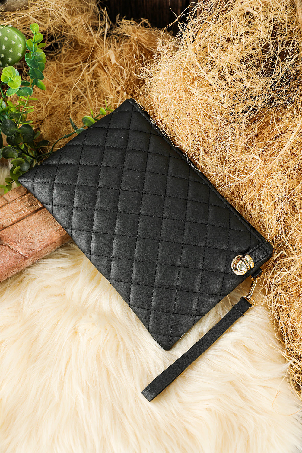 Black Quilted Leather Wrist Strap Clutch Bag